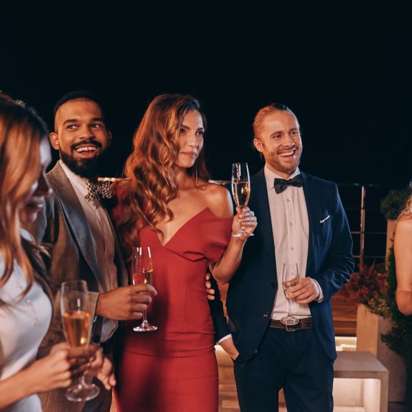 Group,Of,Beautiful,People,In,Formalwear,Communicating,And,Smiling,While